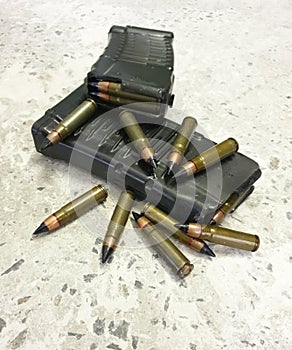 Two rifle mags with bullets on the floor